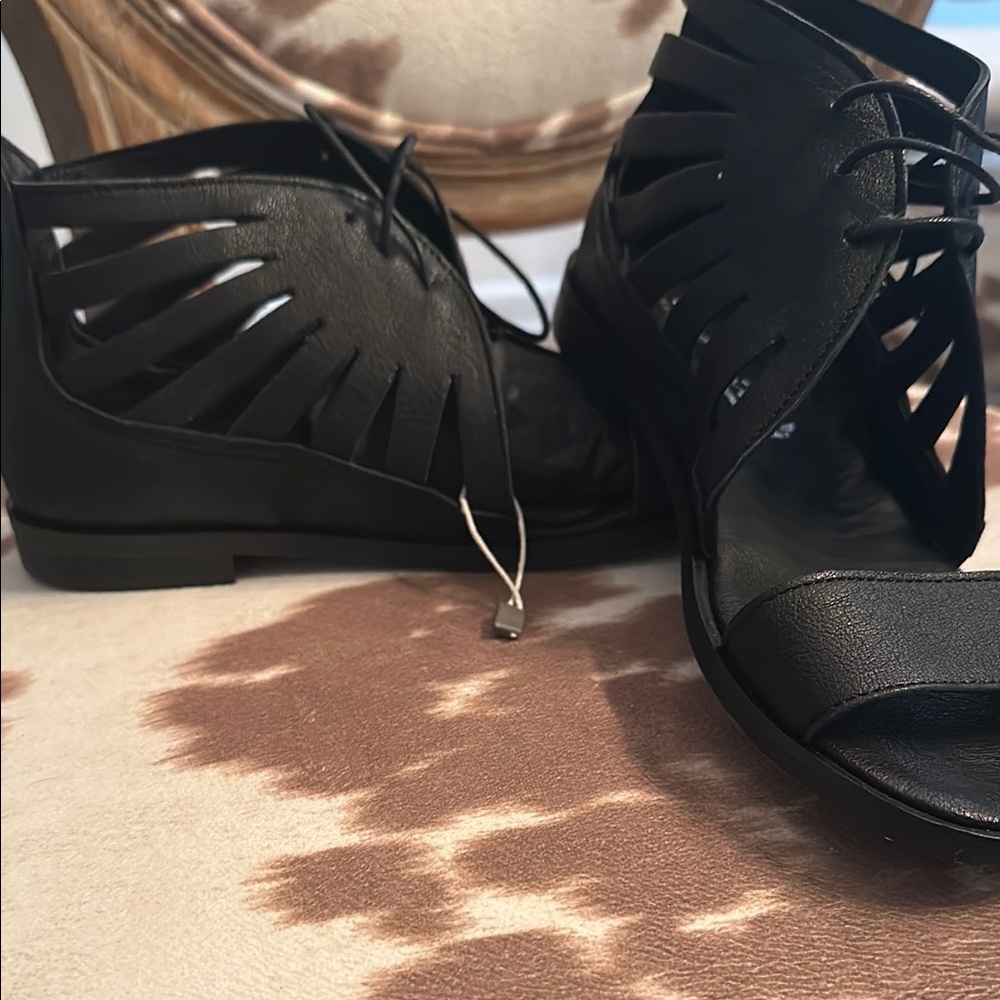 Black Lace-Up Sandals with Intricate Cutouts